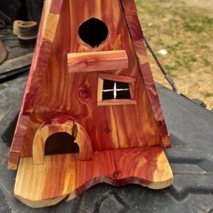 Handcrafted Wooden Birdhouse with Natural Wood Tones